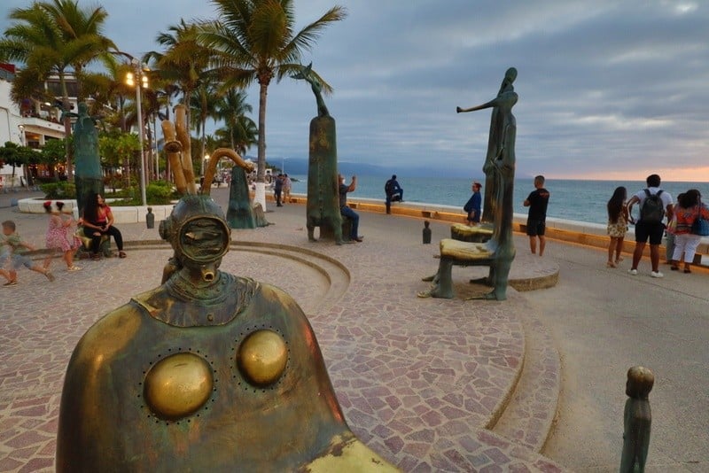 Puerto Vallarta beach board walk surrealist sculptures at sunset