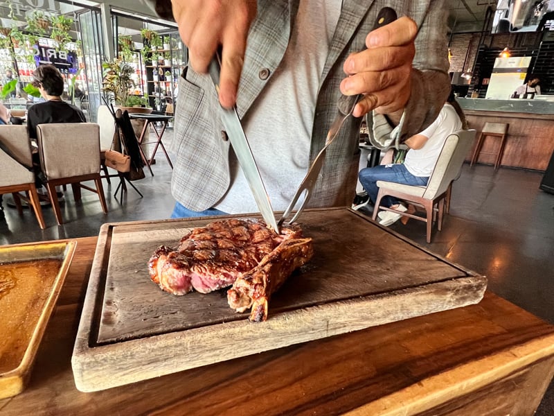 Cutting up a steak Brick Steakhouse in Guadalajara, Jalisco, Mexico