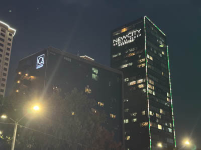 Quartz Hotel and the New City Medical Plaza skyscraper.