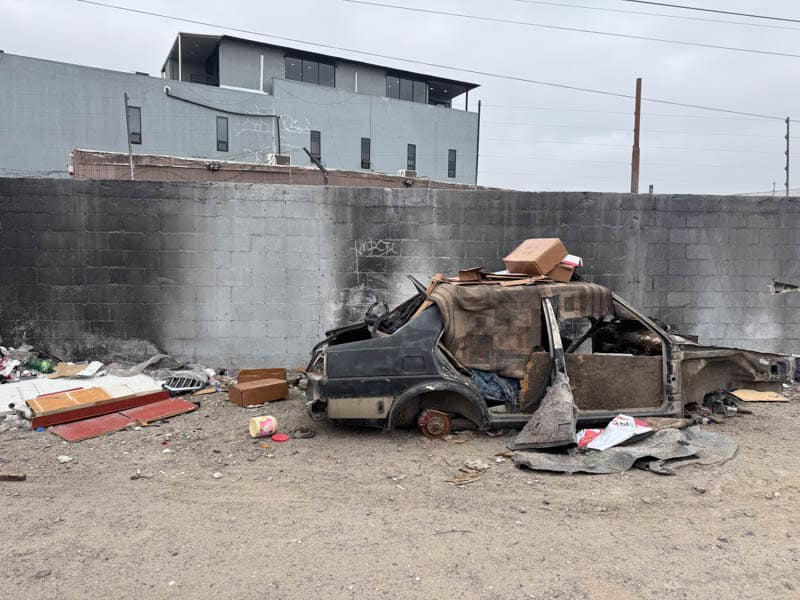 A burnt out car in an area to avoid in Tijuana.